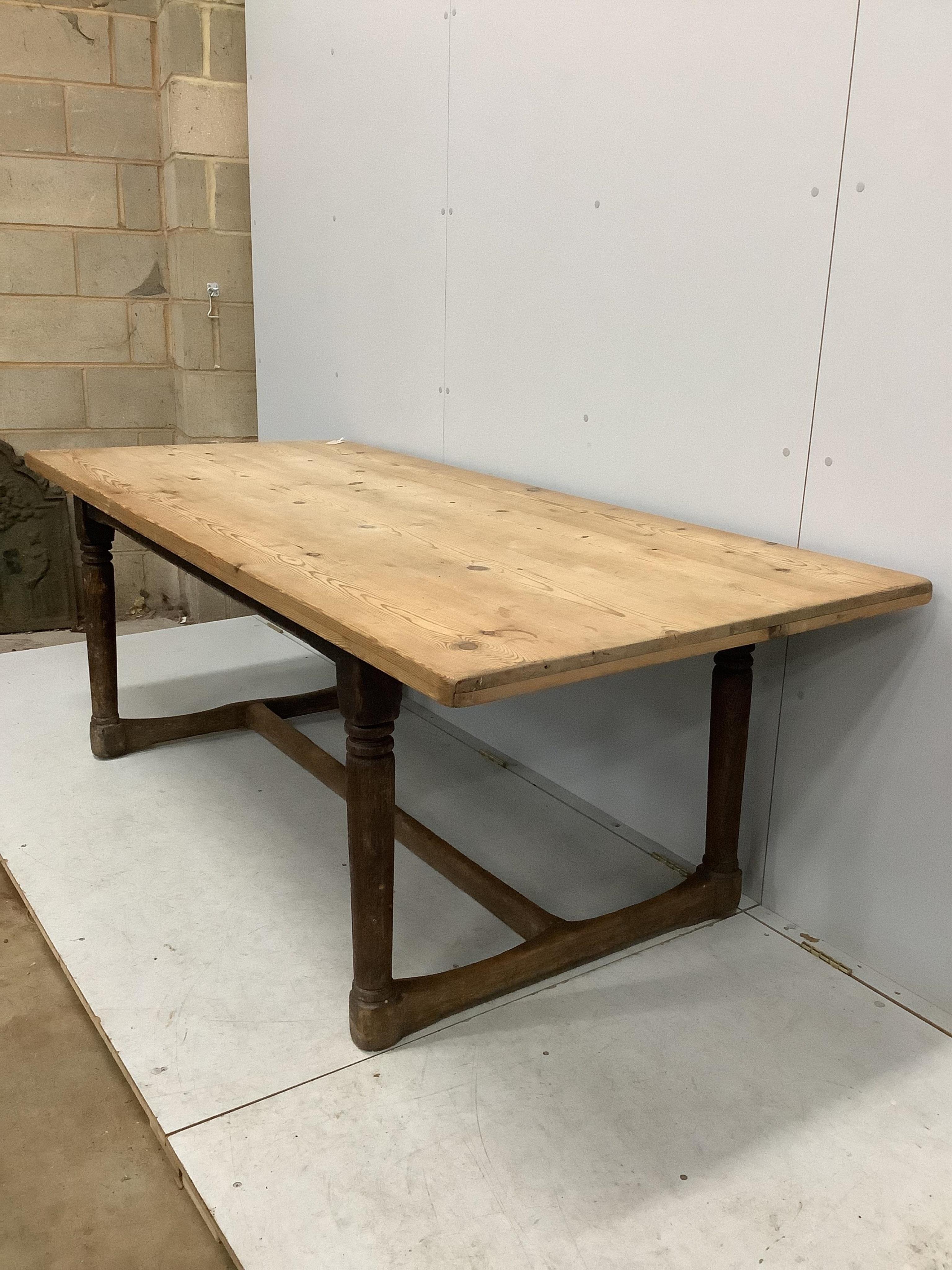 An 18th century oak refectory dining table with later pine top, width 206cm, depth 91cm, height 72cm. Condition - poor to fair